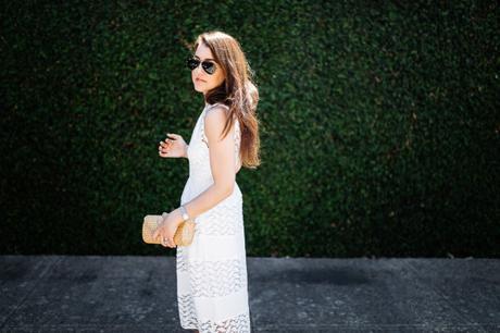 Dallas blogger, Amy Havins, wears a white shoshanna midi dress.