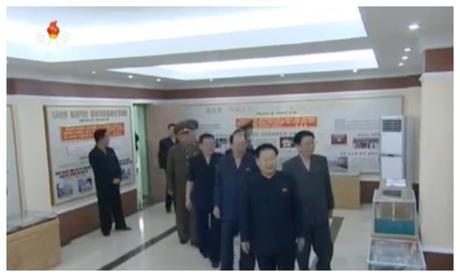 WPK Vice Chairman and WPK Political Bureau Presidium (standing committee) member Choe Ryong Hae, State Planning Commission Chairman and WPK Political Bureau Member Ro Tu Chol and other senior officials visit the factory's history exhibition (Photo: Korean Central TV).