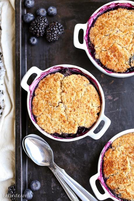 This Blackberry + Blueberry Cobbler is healthy enough for breakfast, but sweet + delicious enough to be dessert! These gluten-free, Paleo, and vegan cobblers have a crisp and gooey topping.