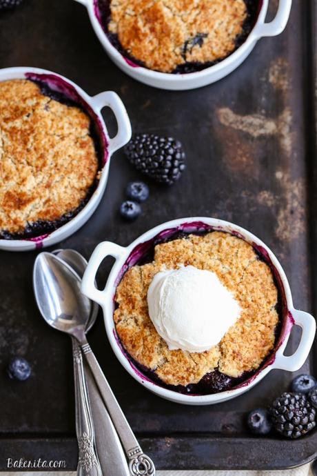 This Blackberry + Blueberry Cobbler is healthy enough for breakfast, but sweet + delicious enough to be dessert! These gluten-free, Paleo, and vegan cobblers have a crisp and gooey topping.