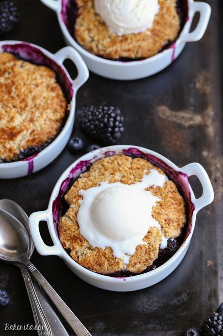 This Blackberry + Blueberry Cobbler is healthy enough for breakfast, but sweet + delicious enough to be dessert! These gluten-free, Paleo, and vegan cobblers have a crisp and gooey topping.