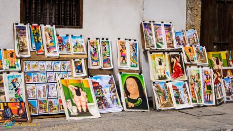Artist sells her renditions of Colombian art on a street in Cartagena.