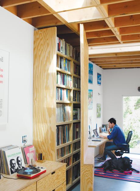 Tall door that swings open to reveal home office