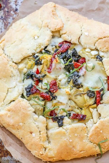 This Spinach + Artichoke Mediterranean Galette has sun-dried tomatoes, artichoke hearts, feta cheese, and gooey mozzarella tucked into a flaky gluten-free and grain-free crust. Pair with a side salad for the perfect lunch or dinner.