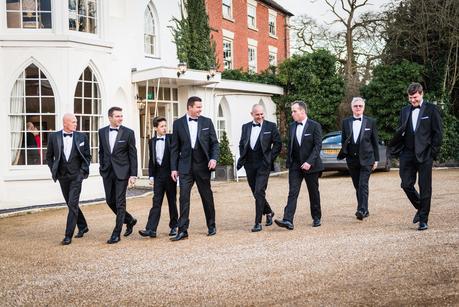 groom and his ushers walking 