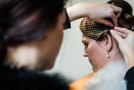 bride having her hair adjusted