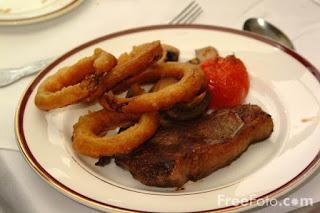 Image: Picture of traditional Sunday Lunch: Steak and Onion Rings (c) FreeFoto.com. Photographer: Ian Britton