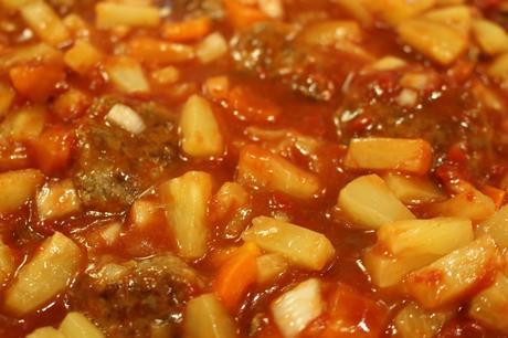 Sweet and Sour Meatballs - meatballs simmering in the sweet and sour sauce