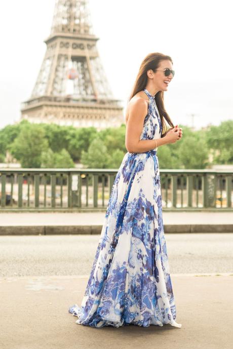Amy Havins wear a blue and white gown by Nardos Design at the Eiffel Tower in Paris. 