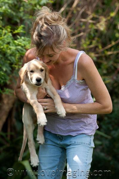 Naomi Estment with Golden Retriever puppy