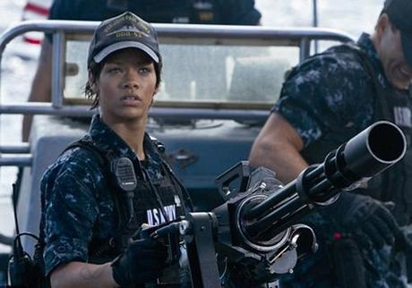 Rihanna On Set Rihanna Rocks the Battleship Poster with Tattoo Covered, Holding Machine Gun Pose