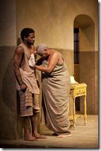 Mai Kuda (Cheryl Lynn Bruce) comforts a distraught Kuda (Warner Miller) in the world-premiere co-production of The Convert by Danai Gurira, directed by Emily Mann.