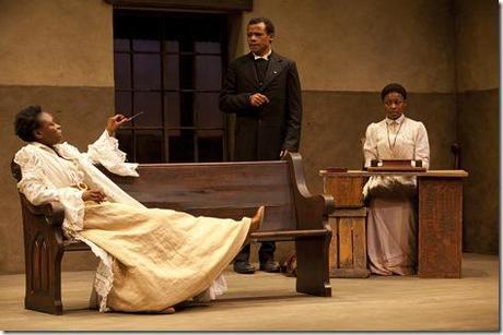 (L to R) Prudence (Zainab Jah) makes a point to Chilford (LeRoy McClain) and Jekesai/Ester (Pascale Armand) in the world-premiere co-production of The Convert by Danai Gurira, directed by Emily Mann.