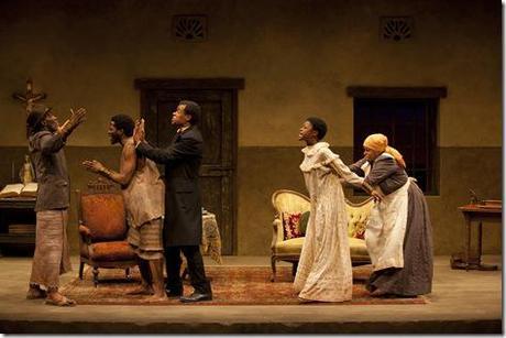 While Chilford (LeRoy McClain) tries to calm Uncle (Harold Surratt) and Kuda (Warner Miller), Mai Kuda (Cheryl Lynn Bruce) holds back Jekesai/Ester (Pascale Armand) during an argument in the world-premiere co-production of The Convert by Danai Gurira, directed by Emily Mann.