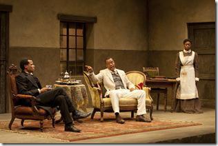 (L to R) Chilford (LeRoy McClain), Chancellor (Kevin Mambo) and Jekesai/Ester (Pascale Armand) rapt in a heated discussion in the world-premiere co-production of The Convert by Danai Gurira, directed by Emily Mann.