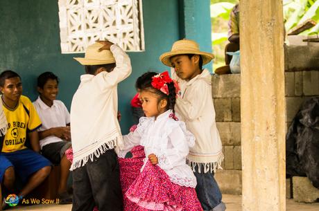 children dance for visitors