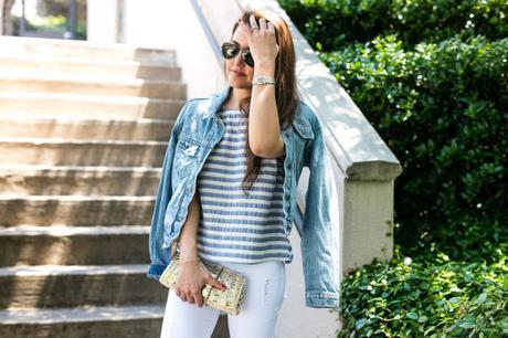 Amy Havins wears white jeans paired with a jean jacket.