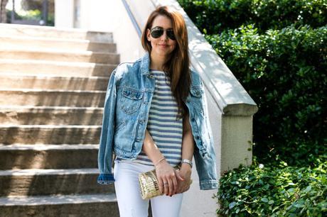 Amy Havins wears white jeans paired with a jean jacket.