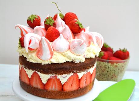 victoria sponge, strawberries, eton mess and meringue kisses all in one big creamy cake