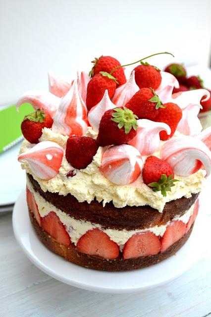 victoria sponge, strawberries, eton mess and meringue kisses all in one big creamy cake