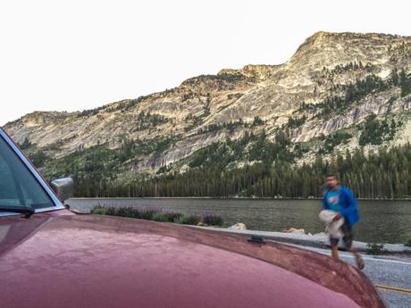 Spenser runs to the car after a post-climb sunset swim in Tenaya Lake.