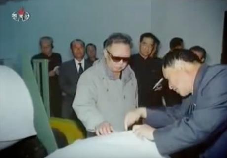 Late DPRK leader Kim Jong Il is briefed about production at P'yo'ngso'ng Synthetic Leather Factory during an October 7, 2011 visit (Photo: NK Leadership Watch file photo).