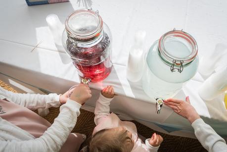 children get a drink at a rustic wedding 