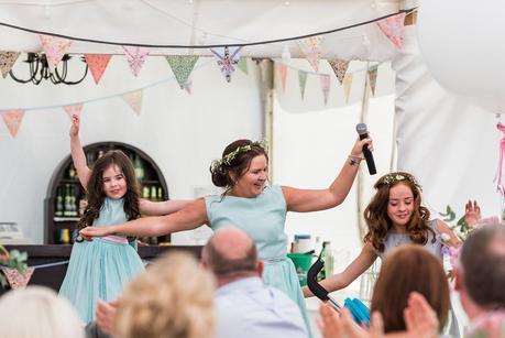 bridesmaid and flower girls dancing 