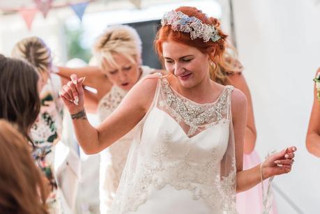 bride having fun on the dancefloor at a rustic wedding