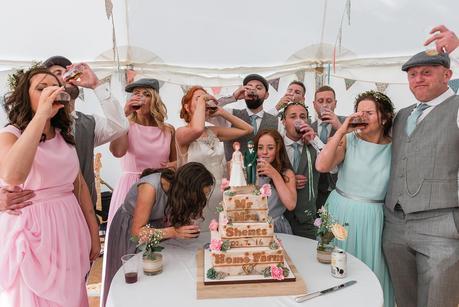 wedding party having a shot of sambuca