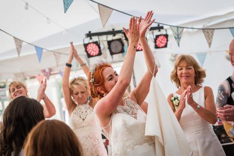 bride clapping on the dancefloor at a wedding