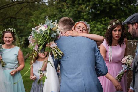 a bride being congratulated outside hillmorton church 