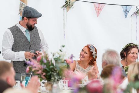 the bride smiling at her husband on their rustic wedding