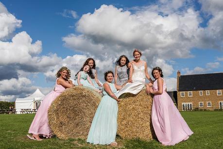 bride posing with her bridesmaids 