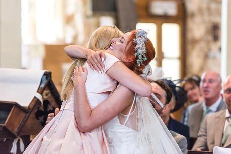 bride hugging a wedding guest