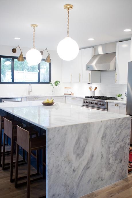 Super White Quartz Counters In Contemporary White Kitchen