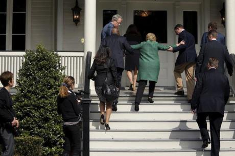 Hillary being helped up stairs 2016