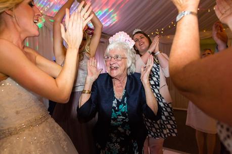 Fun Wedding Photography grandmother on dance floor clapping