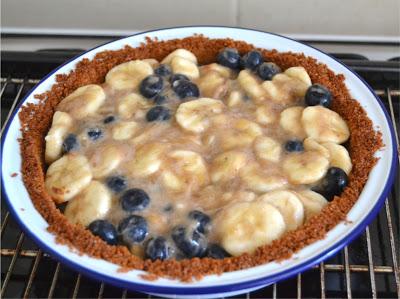 crumb crust pie filled with bananas and blueberries baked and enjoyed either warm or chilled with cream