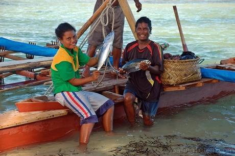 This family just sailed outrigger back from their vegetable garden, an overnight trip in open ocean