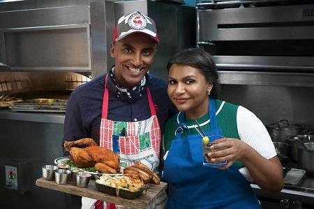 Chef Marcus Sameulsson and Mindy Kaling pose for a photo with Fried Bird Royale in the kitchen at Red Rooster, as seen on Cooking Channel’s Star Plates, Season 1.