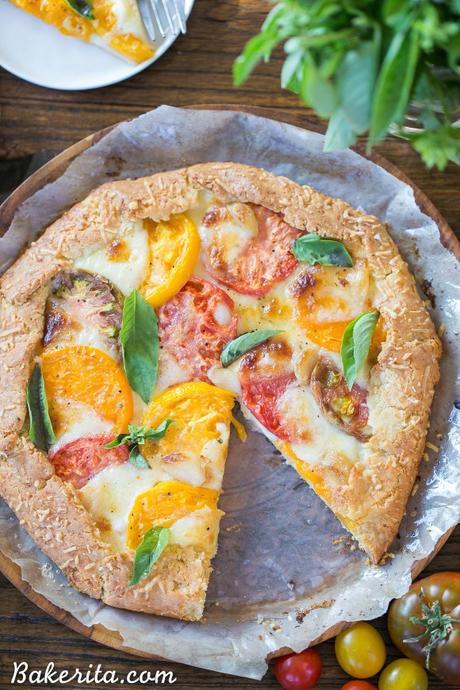 This Mozzarella Heirloom Tomato Galette showcases beautiful heirloom tomatoes bubbling with melted mozzarella cheese, all tucked into a gluten-free + grain-free Parmesan crust. 