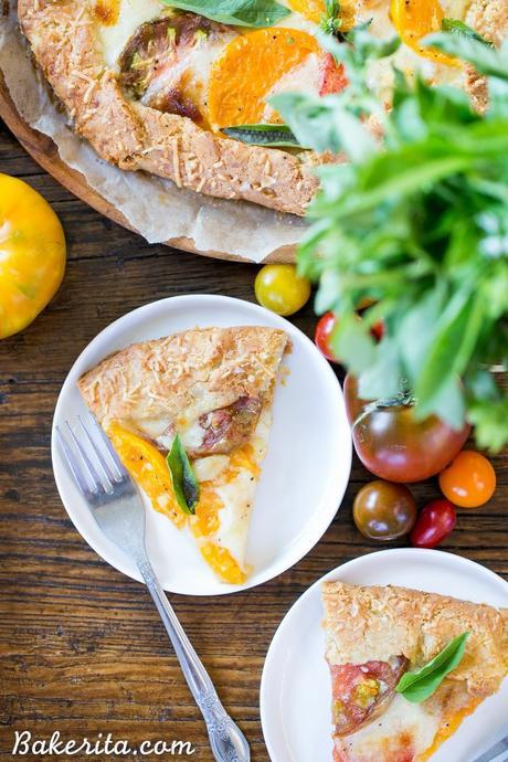 This Mozzarella Heirloom Tomato Galette showcases beautiful heirloom tomatoes bubbling with melted mozzarella cheese, all tucked into a gluten-free + grain-free Parmesan crust. 