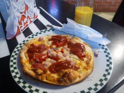 Backpacking in Poland: Exploring Peaceful, Pleasant, Holy Pelplin Pizza and orange juice in Pelplin's international pizza joint