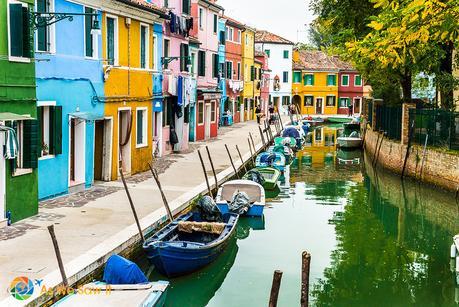Colorful buildings along a canal on Burano island
