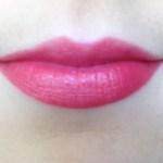 Mirabella Lipstick in Cherry Shine on lips