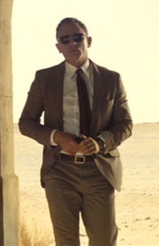 Spectre – Brown Linen-Blend Jacket in Morocco James Bond (Daniel Craig) checks his Walther PPK in Spectre (2015).