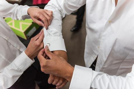 cufflinks being put on