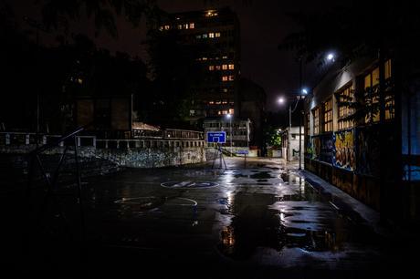 A school backyard on a rainy night.