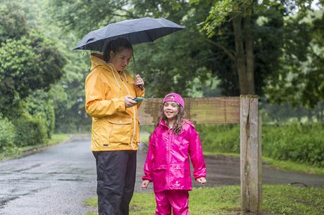 What is Geocaching - Zoe and Bubs in te rain looking for a cache